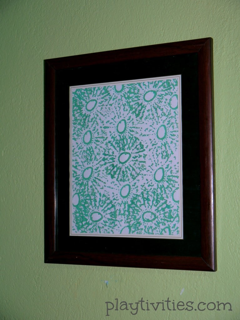 Crotchet coaster stamping on a wall.