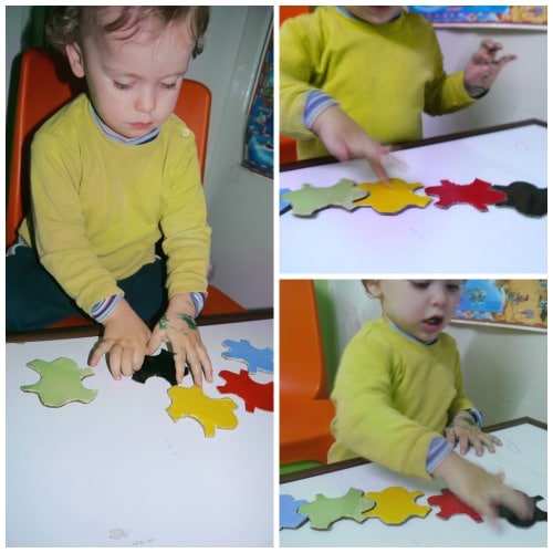 3 images of young boy playing with an olympic puzzle.