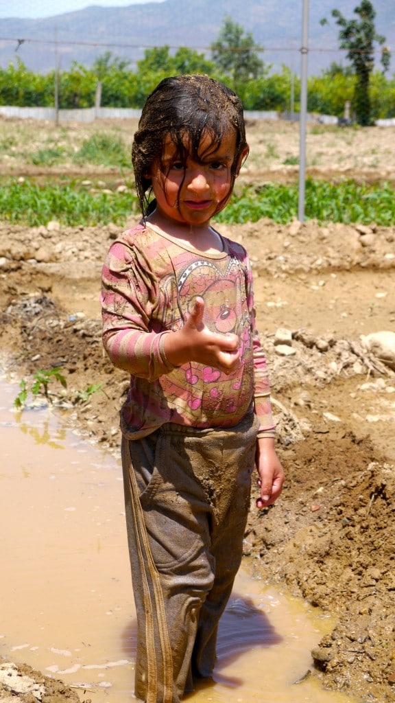 Kid in a mud bath