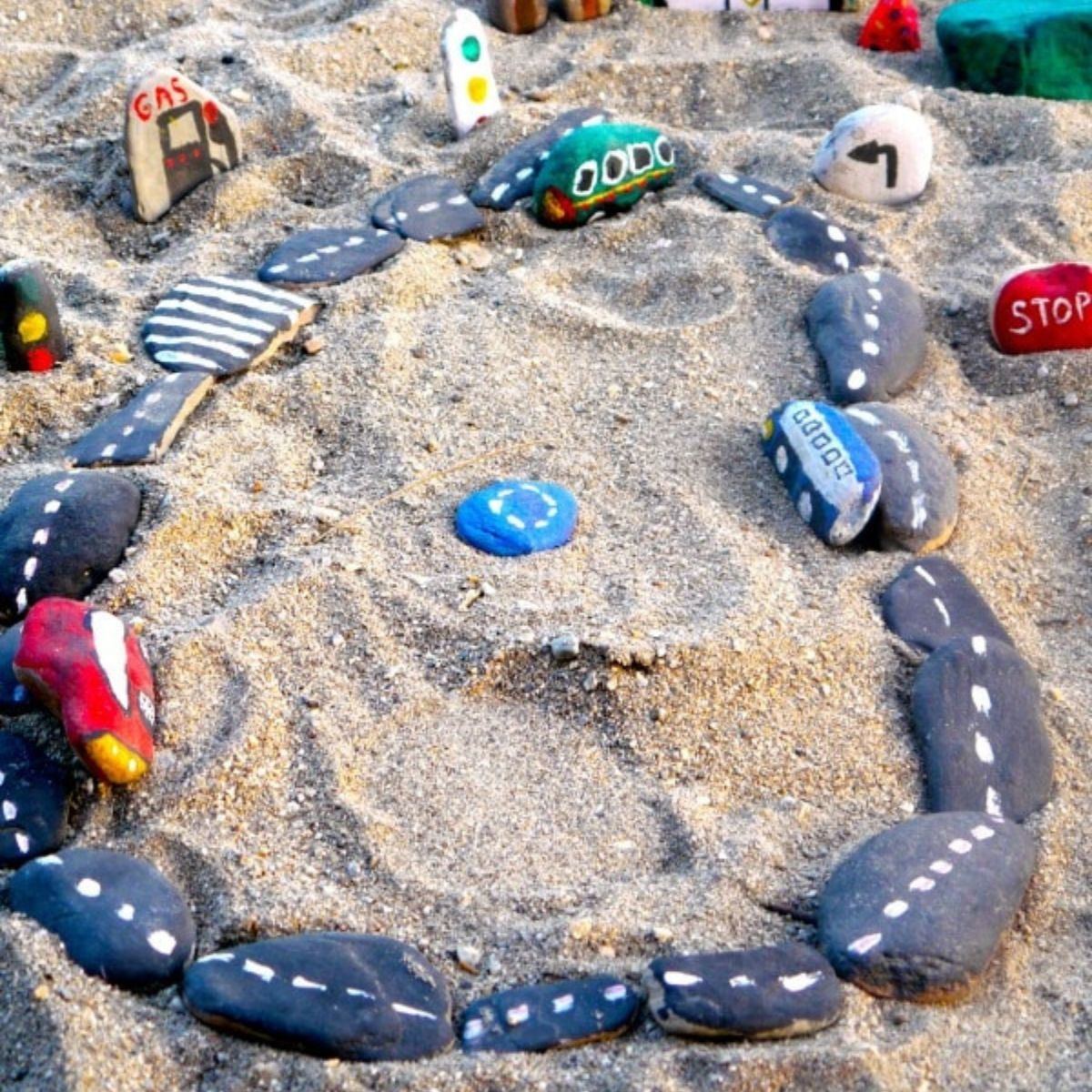 Diy car rock track on a beach,