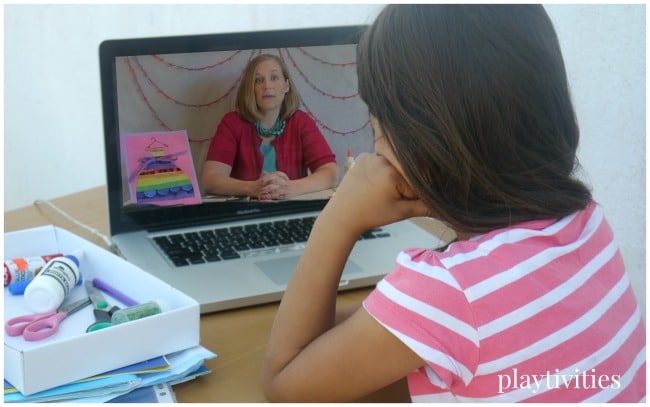 Young girl watching a video on a laptop