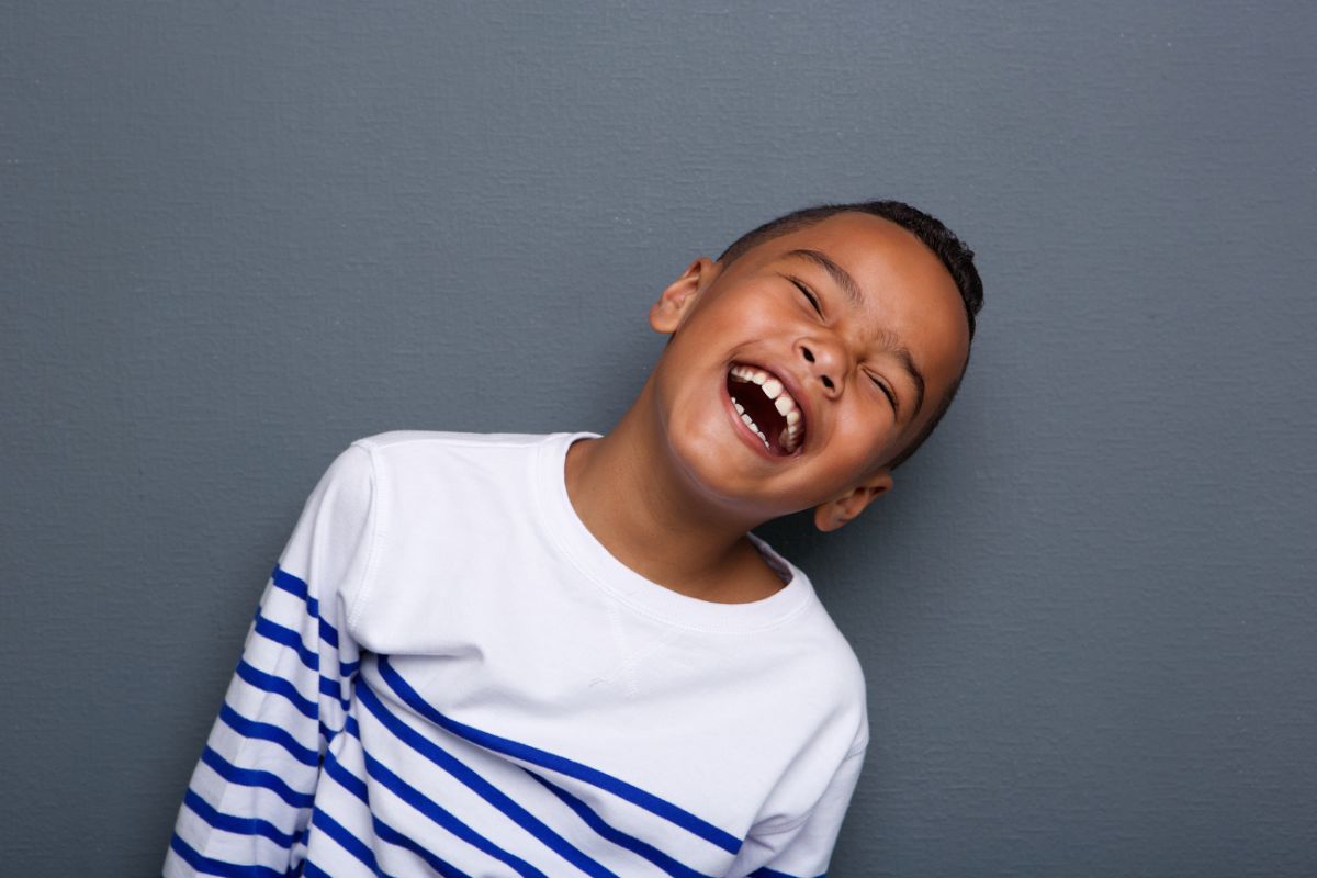 Young black children laughing,