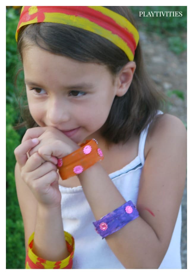 Young girl wearing a plastic jewelry.