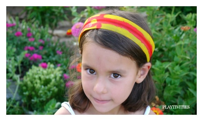 Young girl wearing a homemade headband.