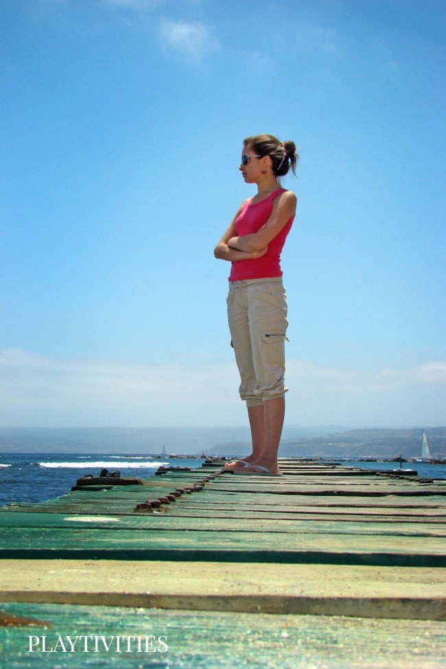 Woman standing on a pier.