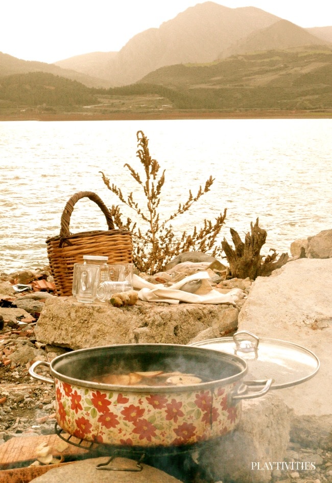 Ginger tea cooking outdoor near lake..