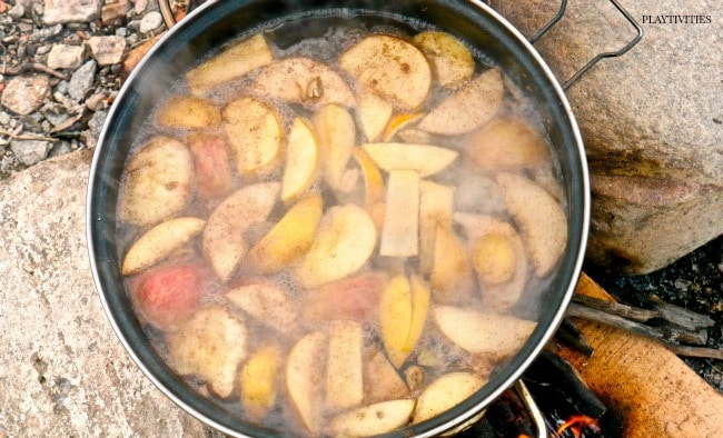 Cooking ginger tea in a big pan outdoor.