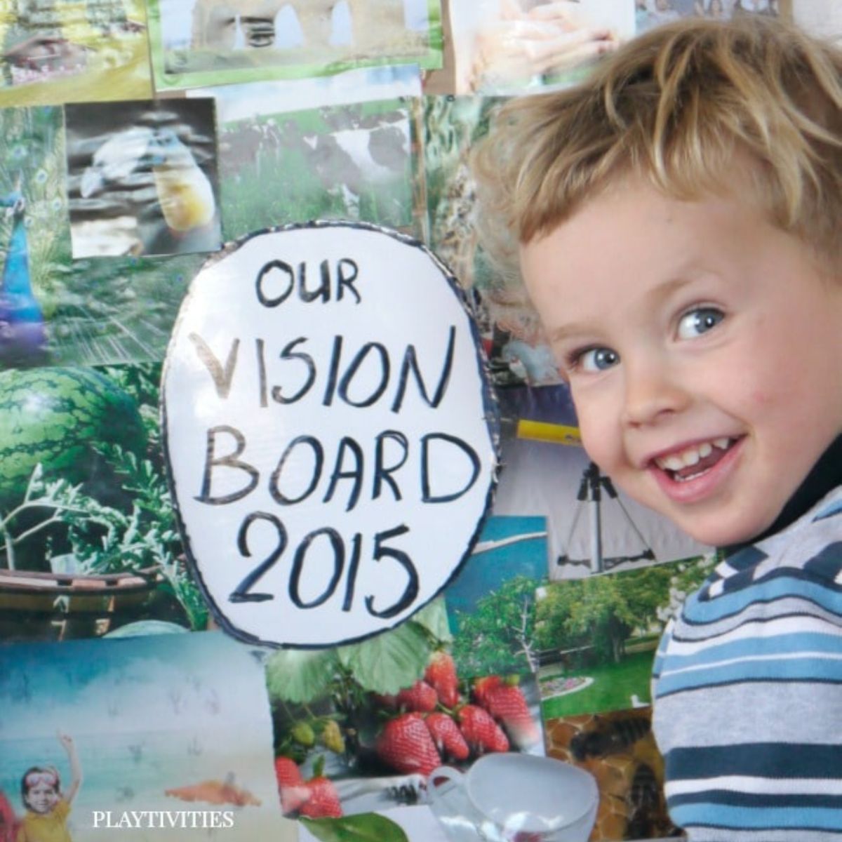 Smiling boy infront of vision board.