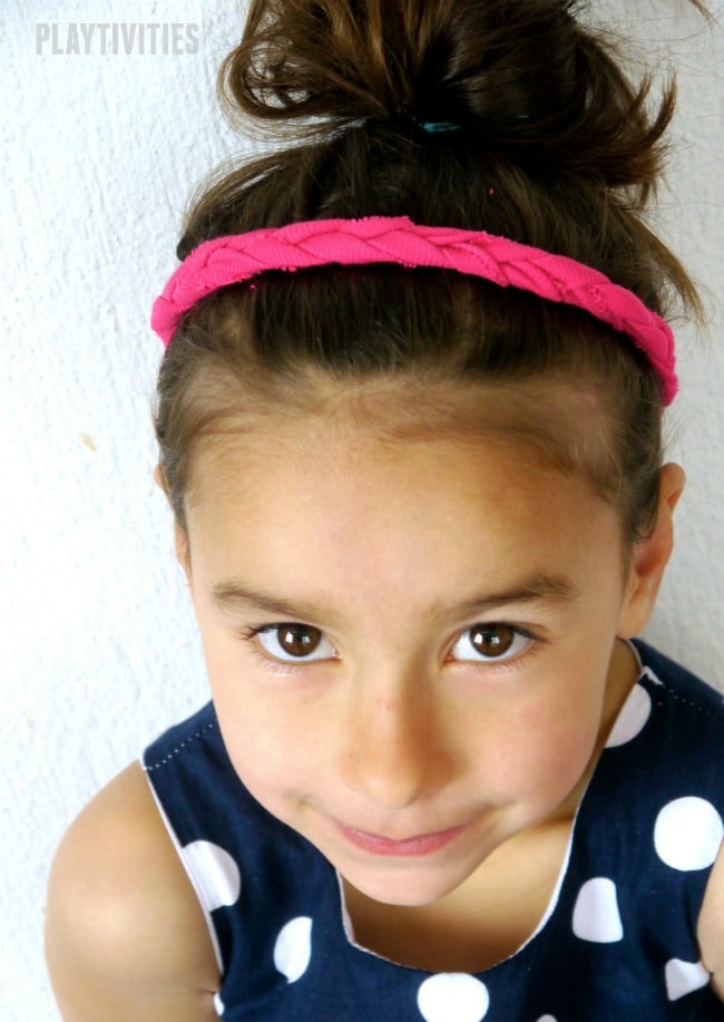 Young girl wearing a diy pink headband.