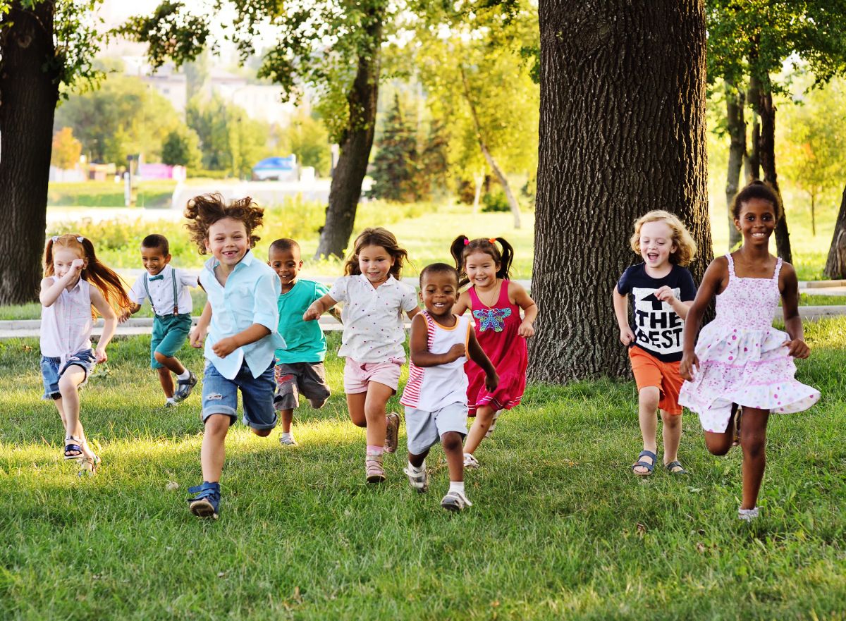 Bunch of kids running in a woods