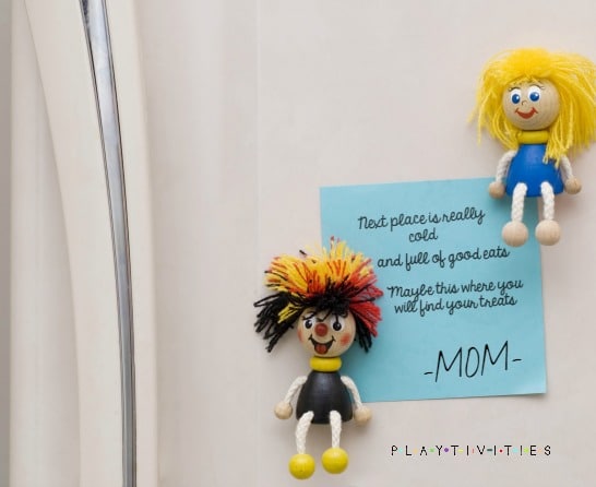 surprise kids with treasure hunts - two toys and a note from mom on a wall.