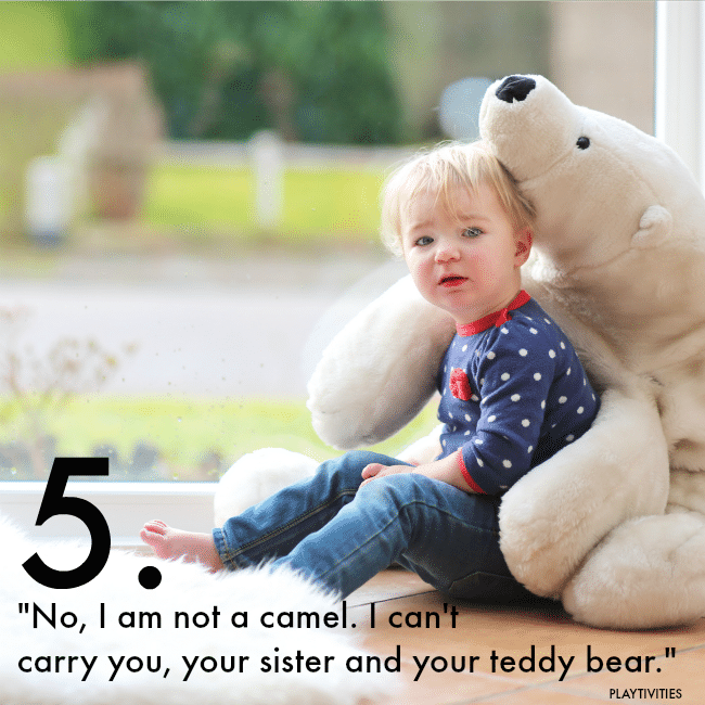 Little girl leaning on teddy bear.