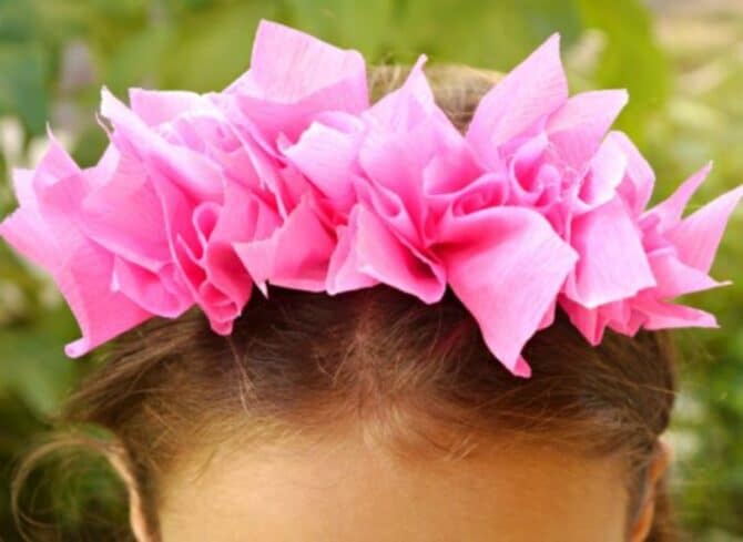 Pink Paper Tissue Headband on head.