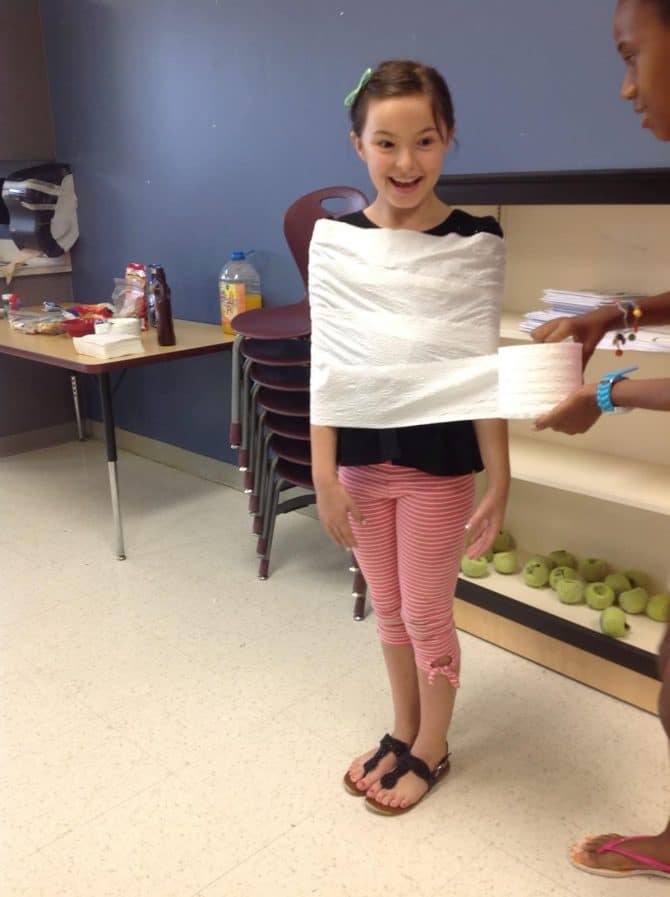 Dressing up as a mummy with toilet paper