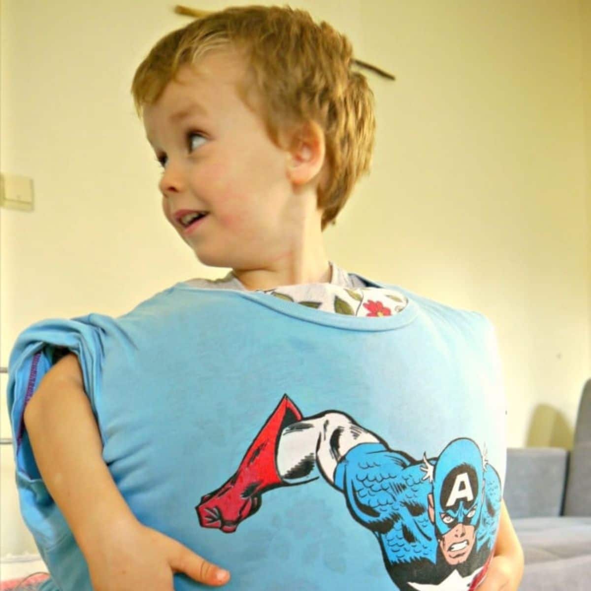 Kid wearing a pillow and playing a pillow wrestling.