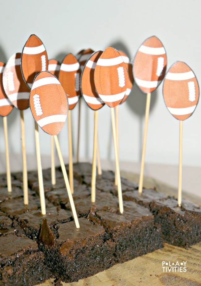 Football brownies  with sticks.