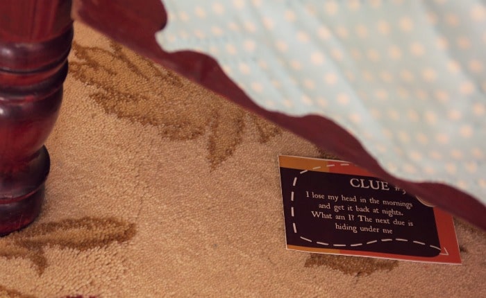 Treasure hunt clue card under a bed.