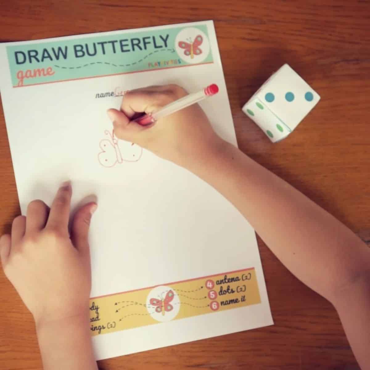Girl playing butterfly drawning game.