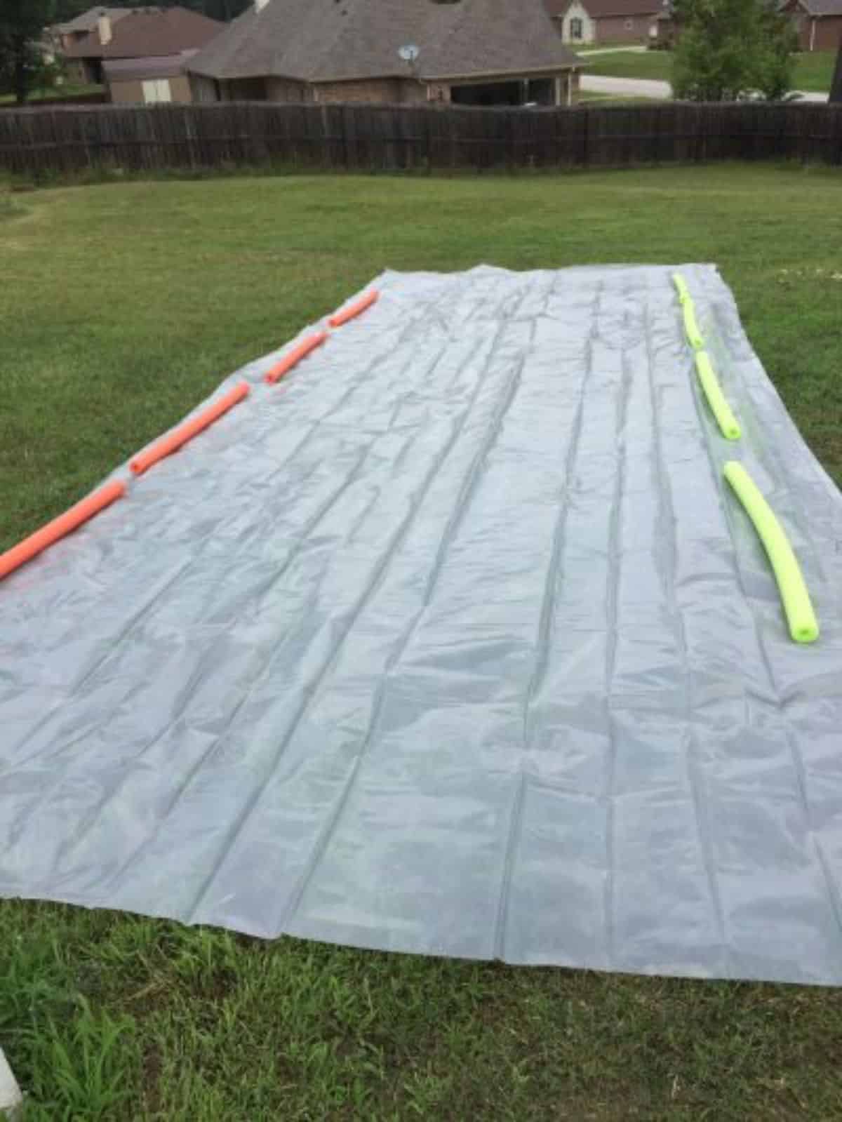 DIY slip and slide game at backyard.