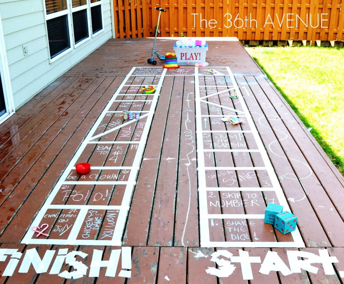 DIY outdoor board game on a wooden deck.
