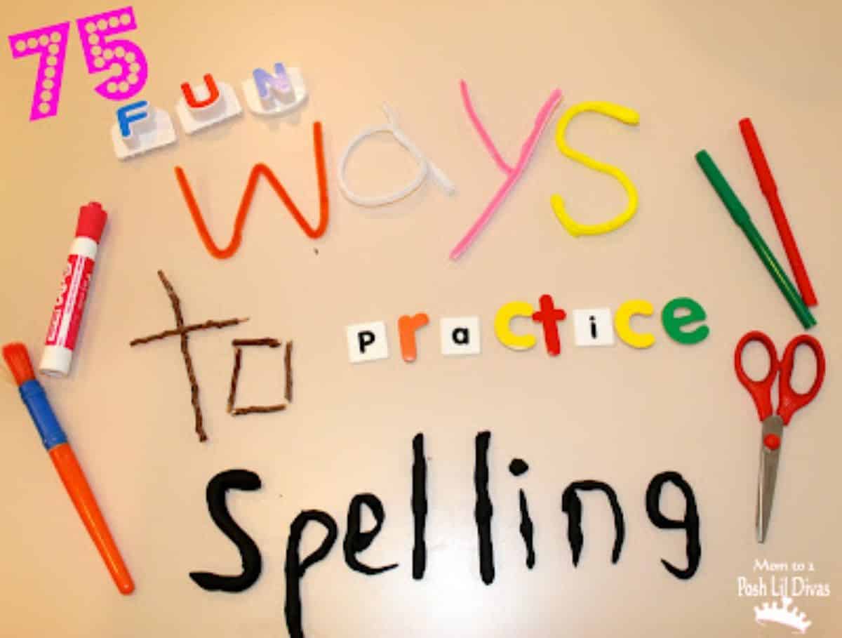 Spelling game concept on a table with scissors, pens, glue, straw and other components.