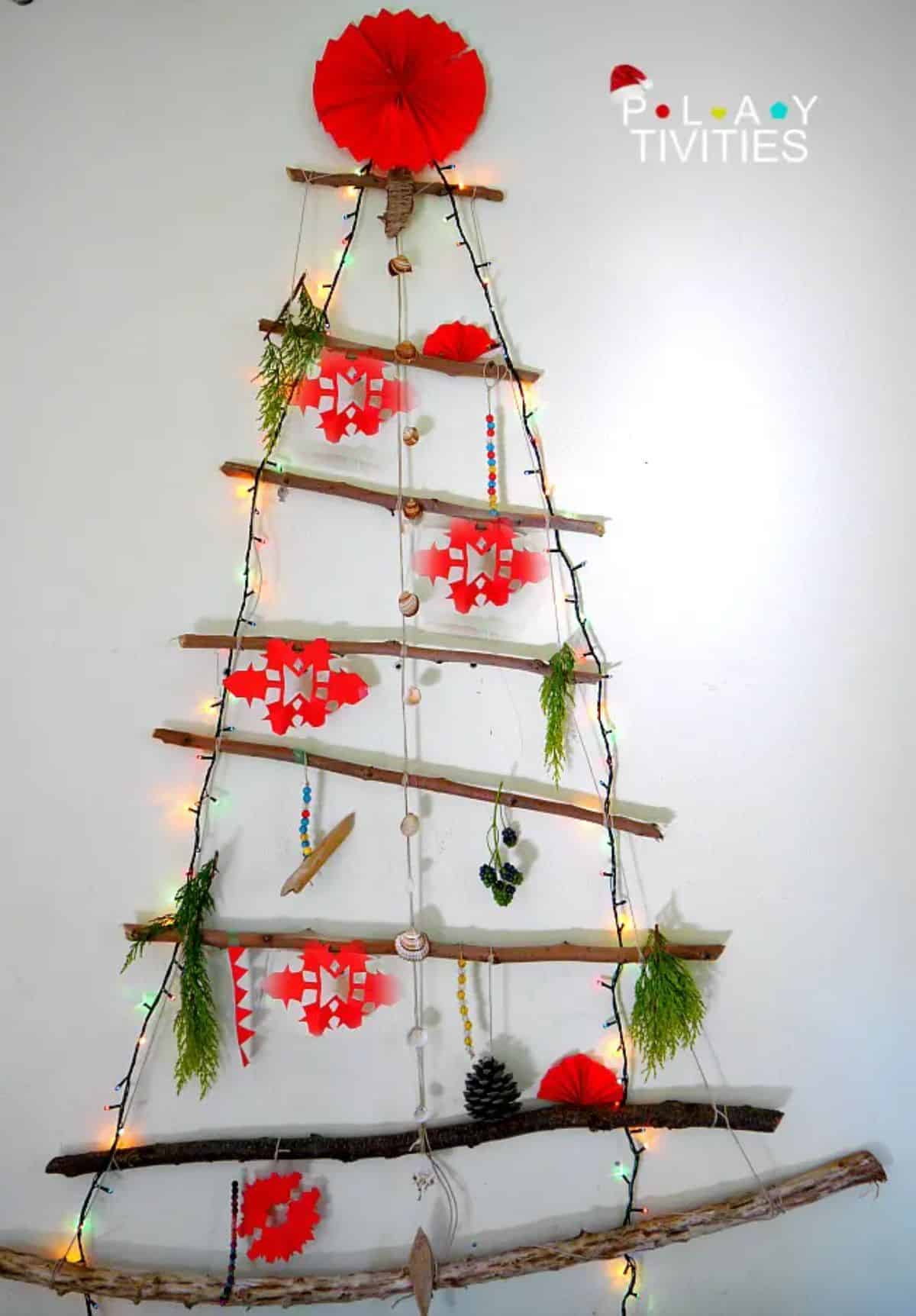 Minimalist christmas tree hanging on a wall.