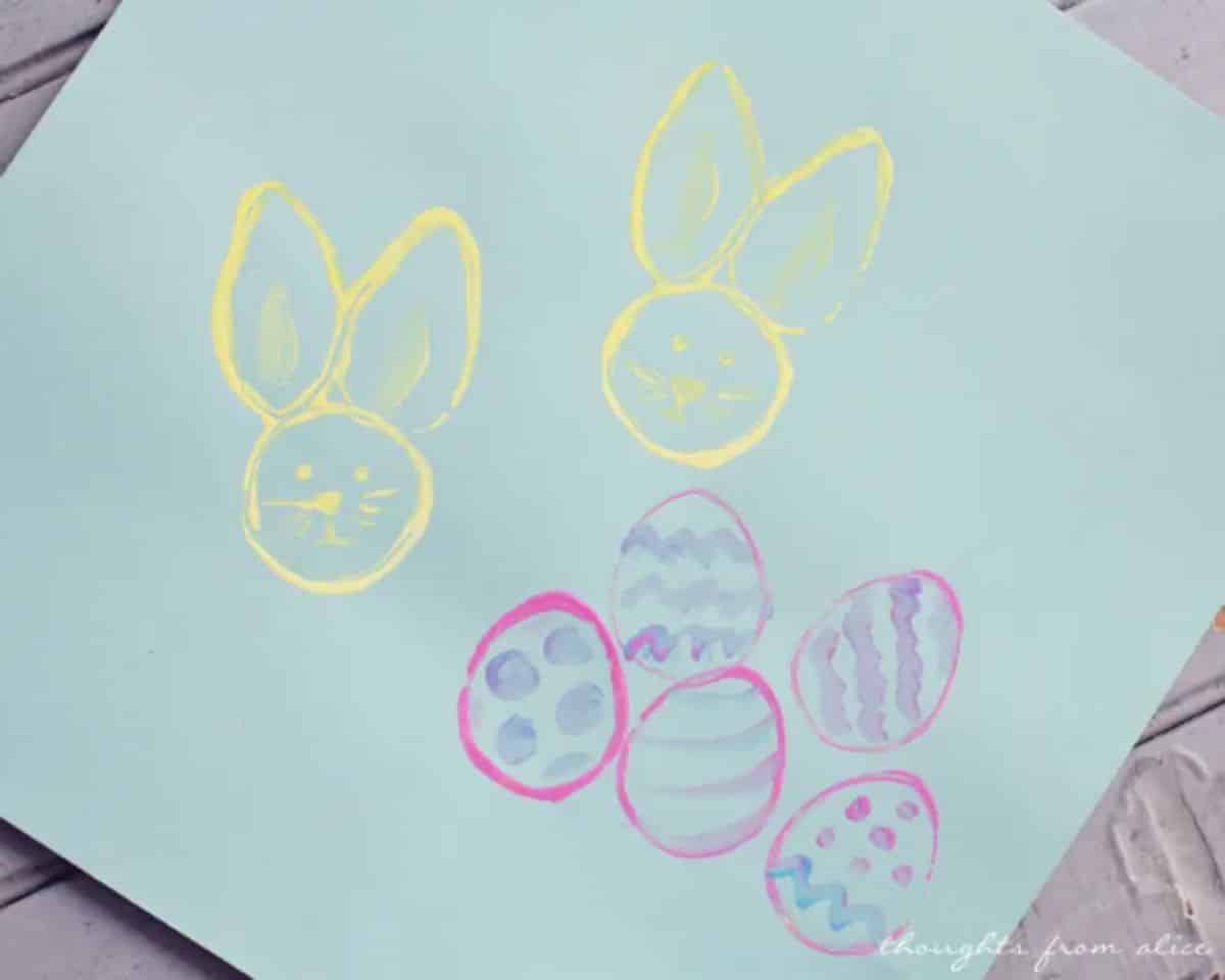 Easter Bunny And Egg Stamps on a green paper sheet.