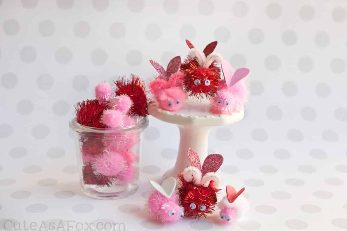 Love Bugs Valentine’s Day Kids Craft on a tray, in a jar and on a table.