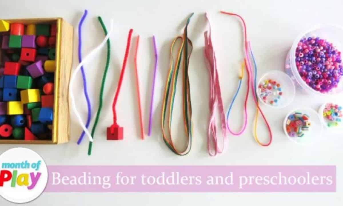 Beading for toddlers and preschoolers on a table with needed componetcs.