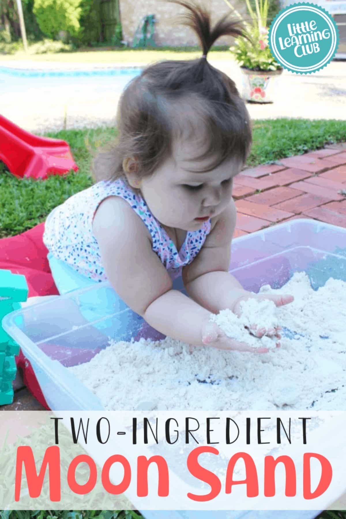 Little girl playing in a container with Two Ingredient Moon Sand