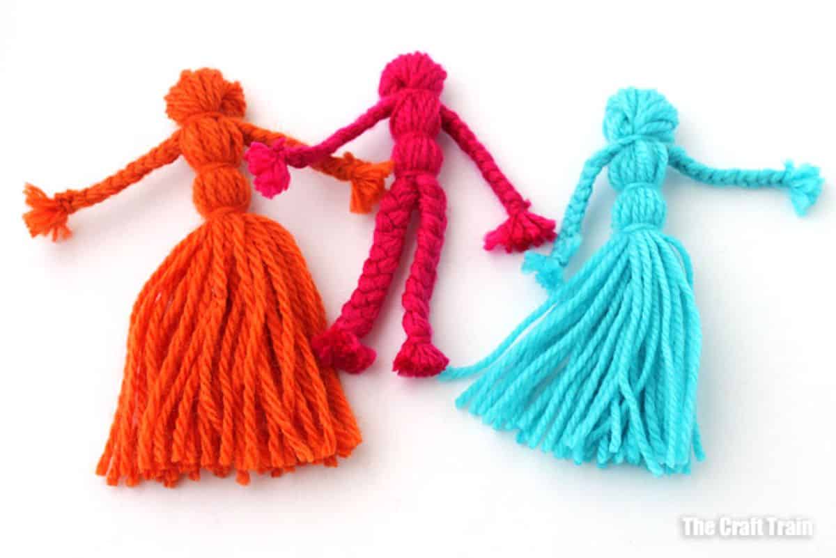 Colorful yarn dolls.