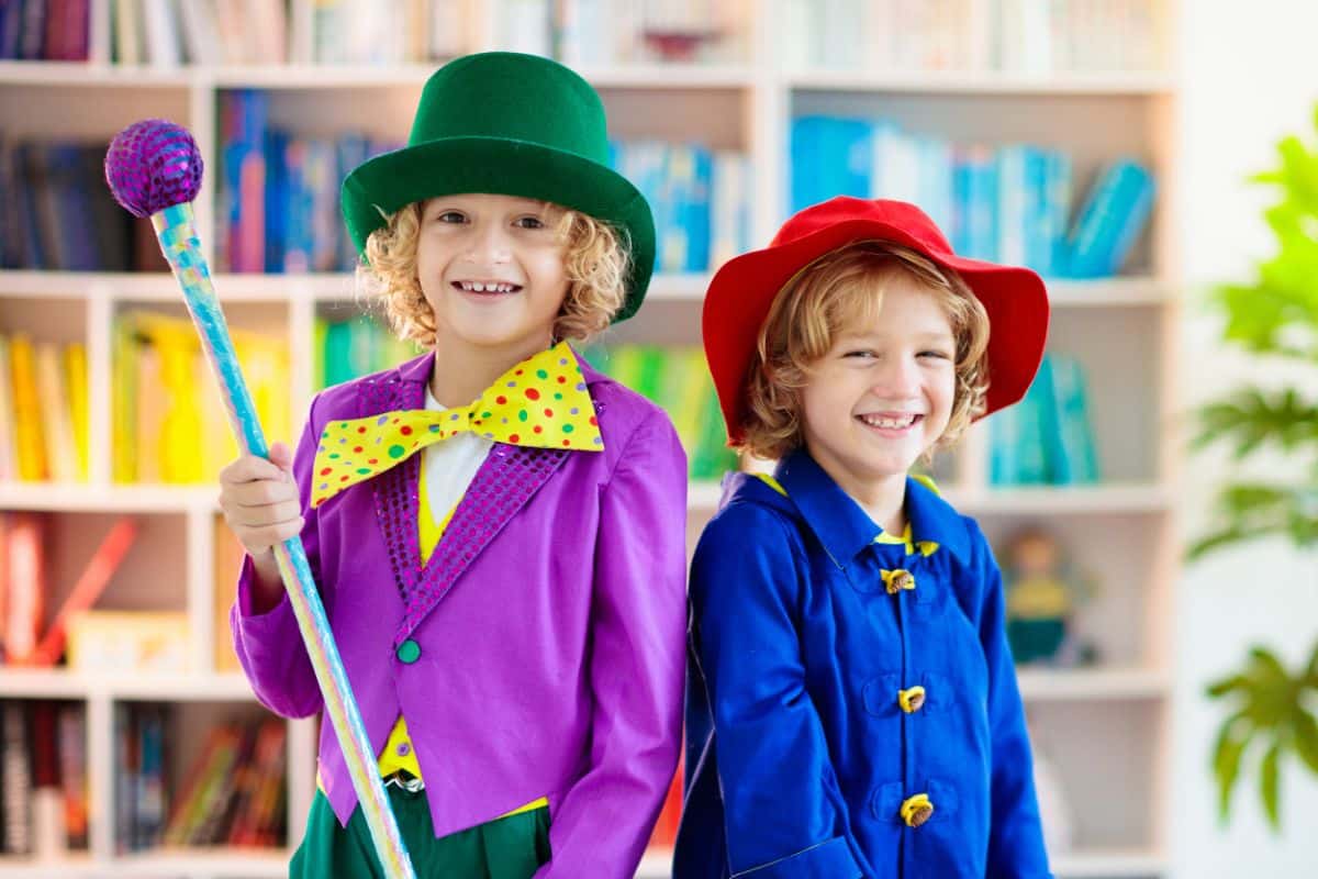 Two kids dressed up as characters from Willy WOnka movie.