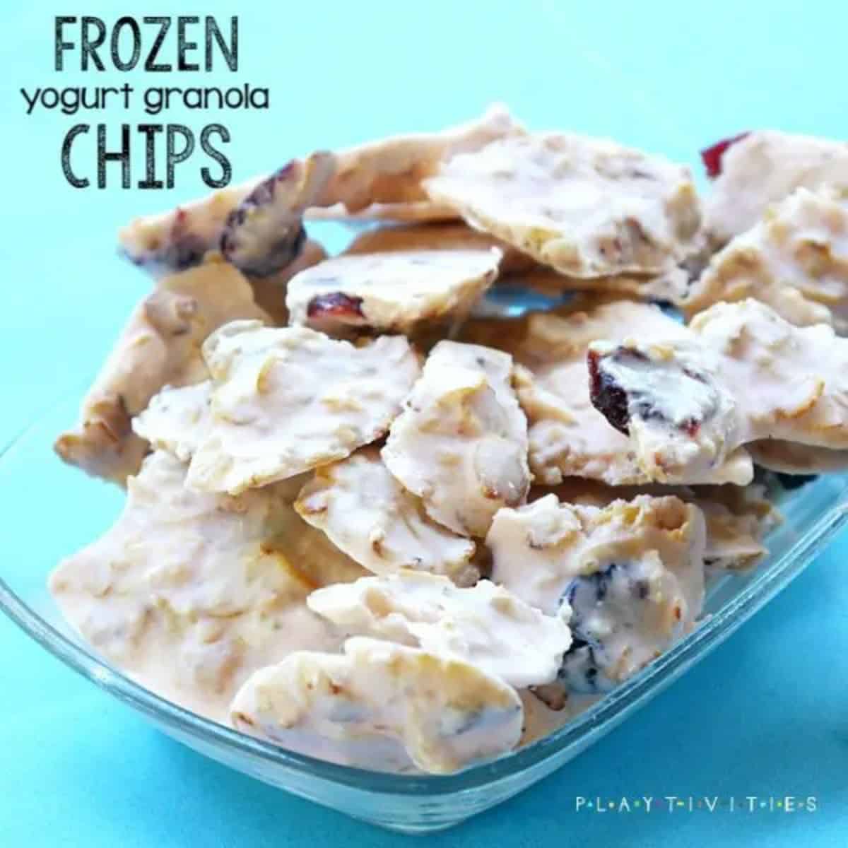 Frozen yogurt granula chips in a glass bowl.