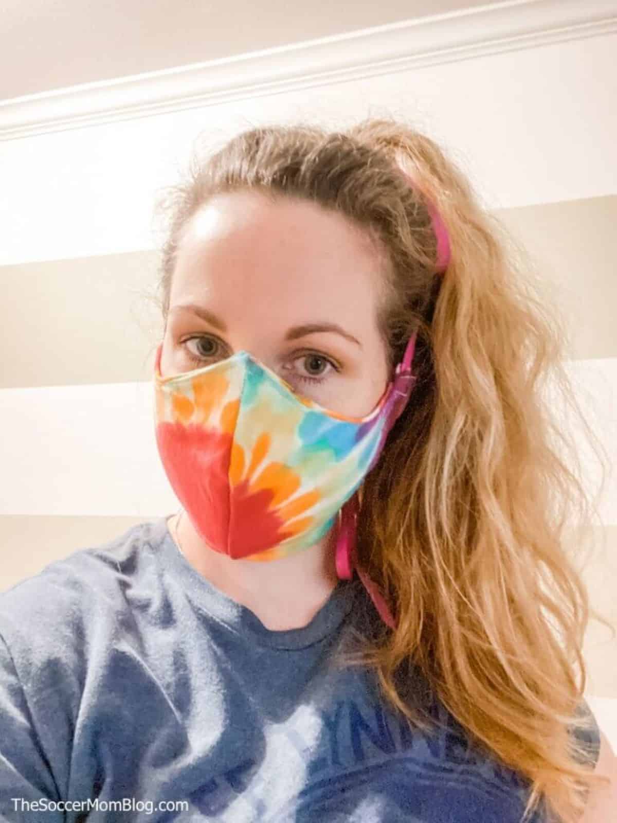 Girl wearing a face mask from T-shirt.