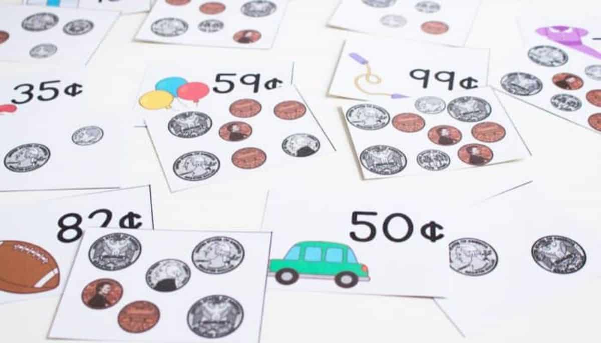 Paper sheets  with printed coins , small car, ballons and value in cents.