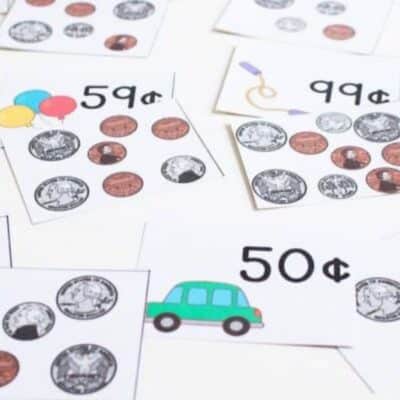 Small paper hseets with printed coin, small car, baloon and money value in cents.