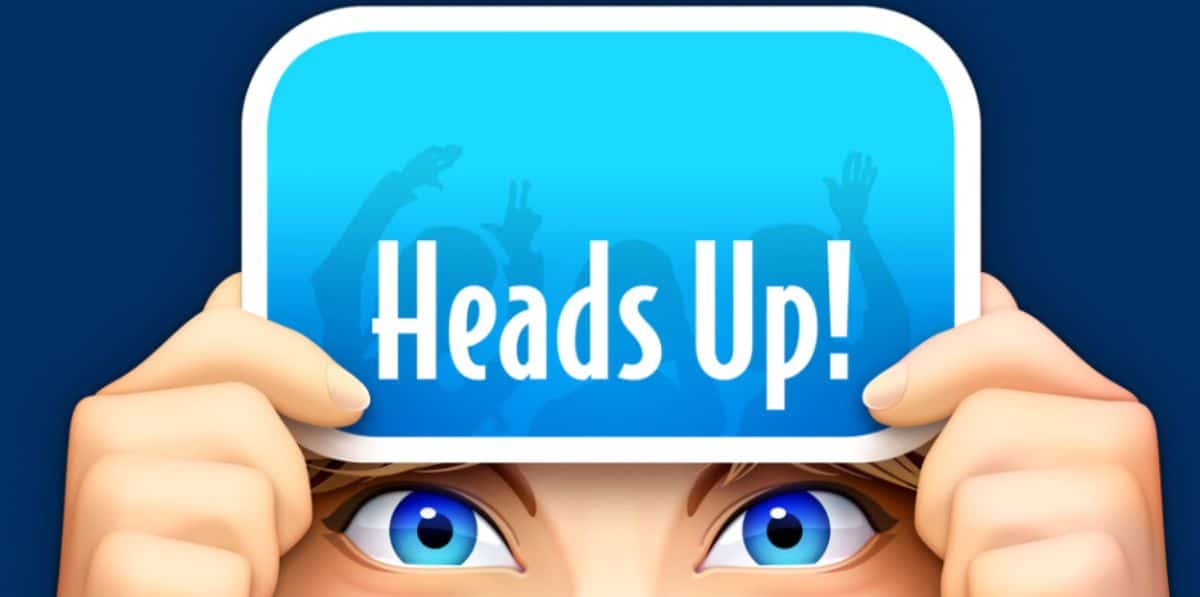 A cartoon of a woman's face holding a blue card in front of their head with the words "Heads Up!" on it