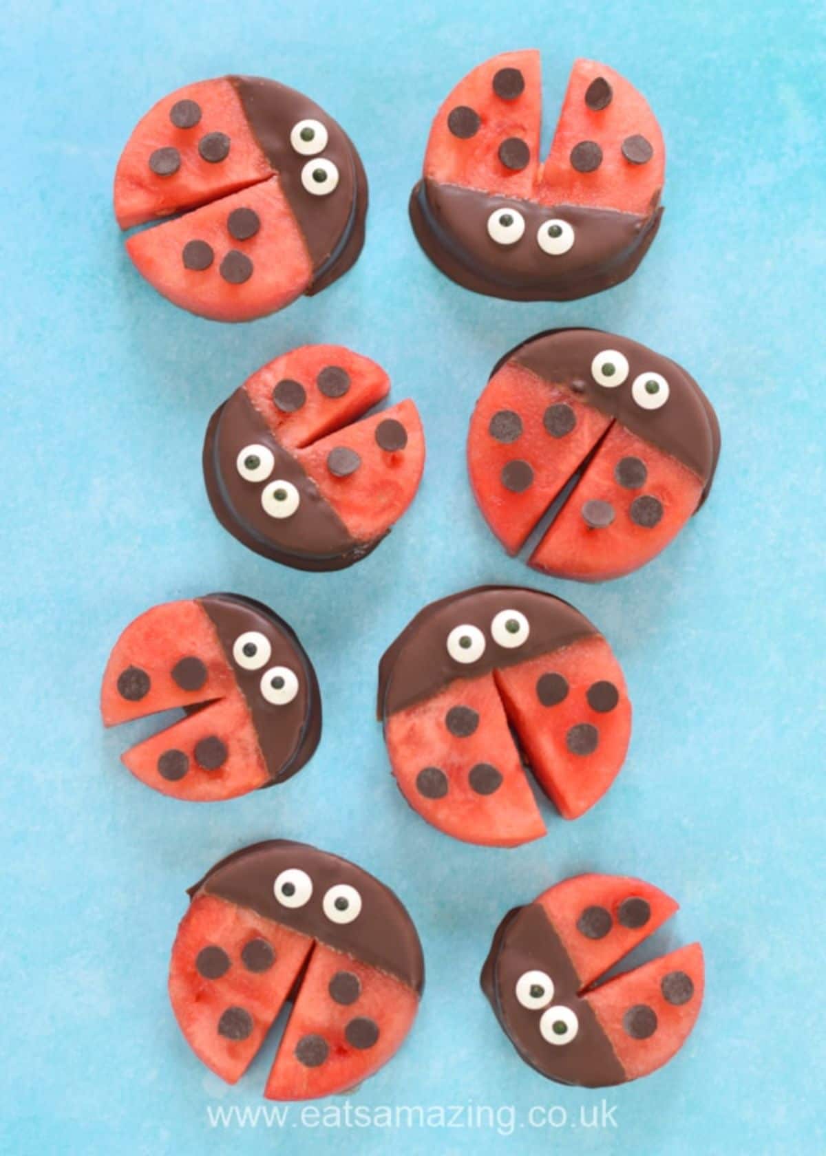 8 small ladybirds made of watermelon slices and chocolate