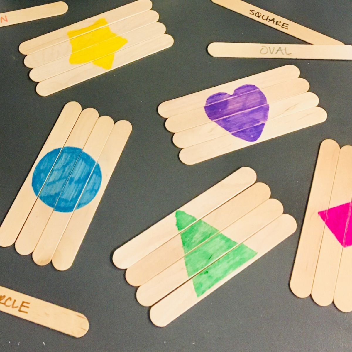 popsicle sticks have been placed together to make different shapes