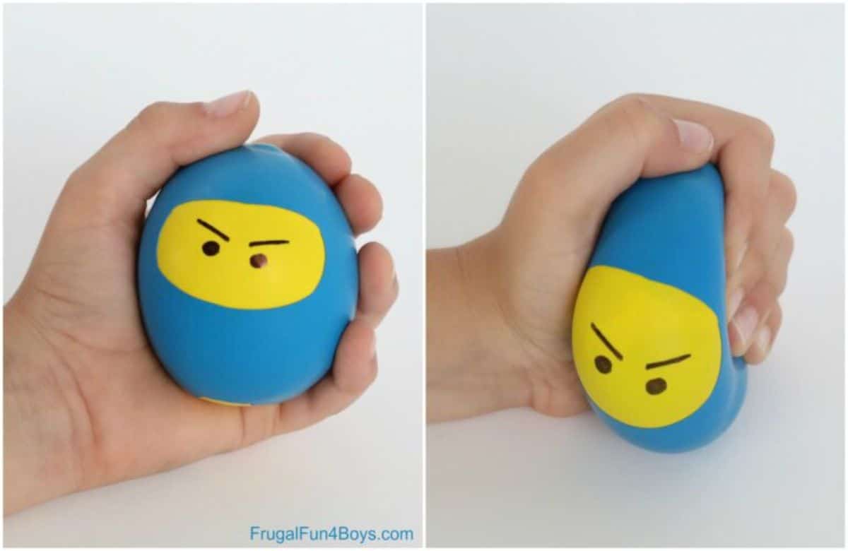2 images of a stress ball decorated to look like a blue and yellow ninja is being squeezed by a hand