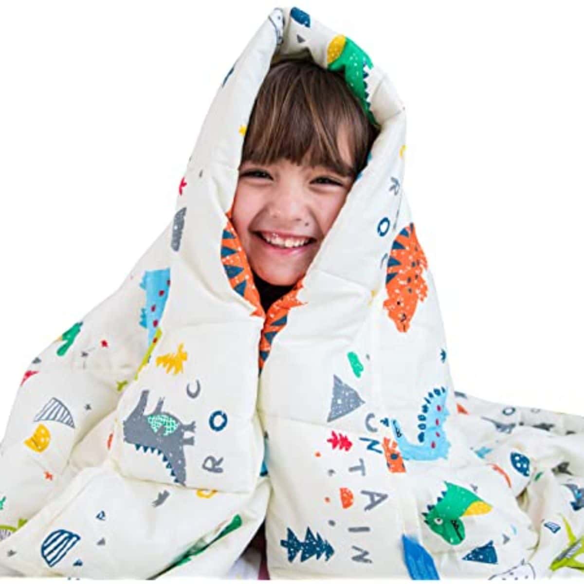 a boy is wrapped in a blanket decorated with dinosaurs