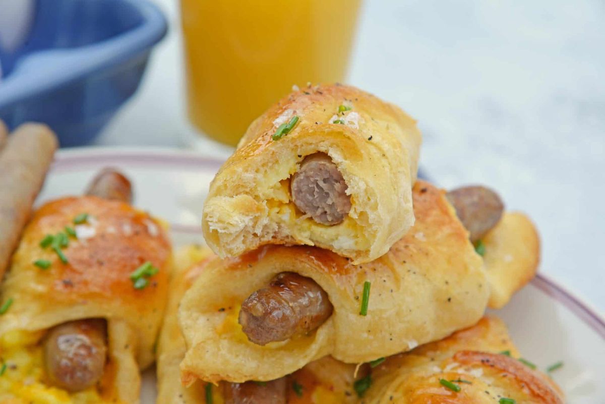 a plate full of sausage crescent rolls
