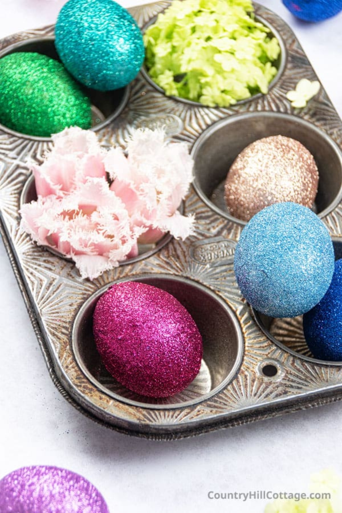 Green, blue and pink glitter Easter eggs