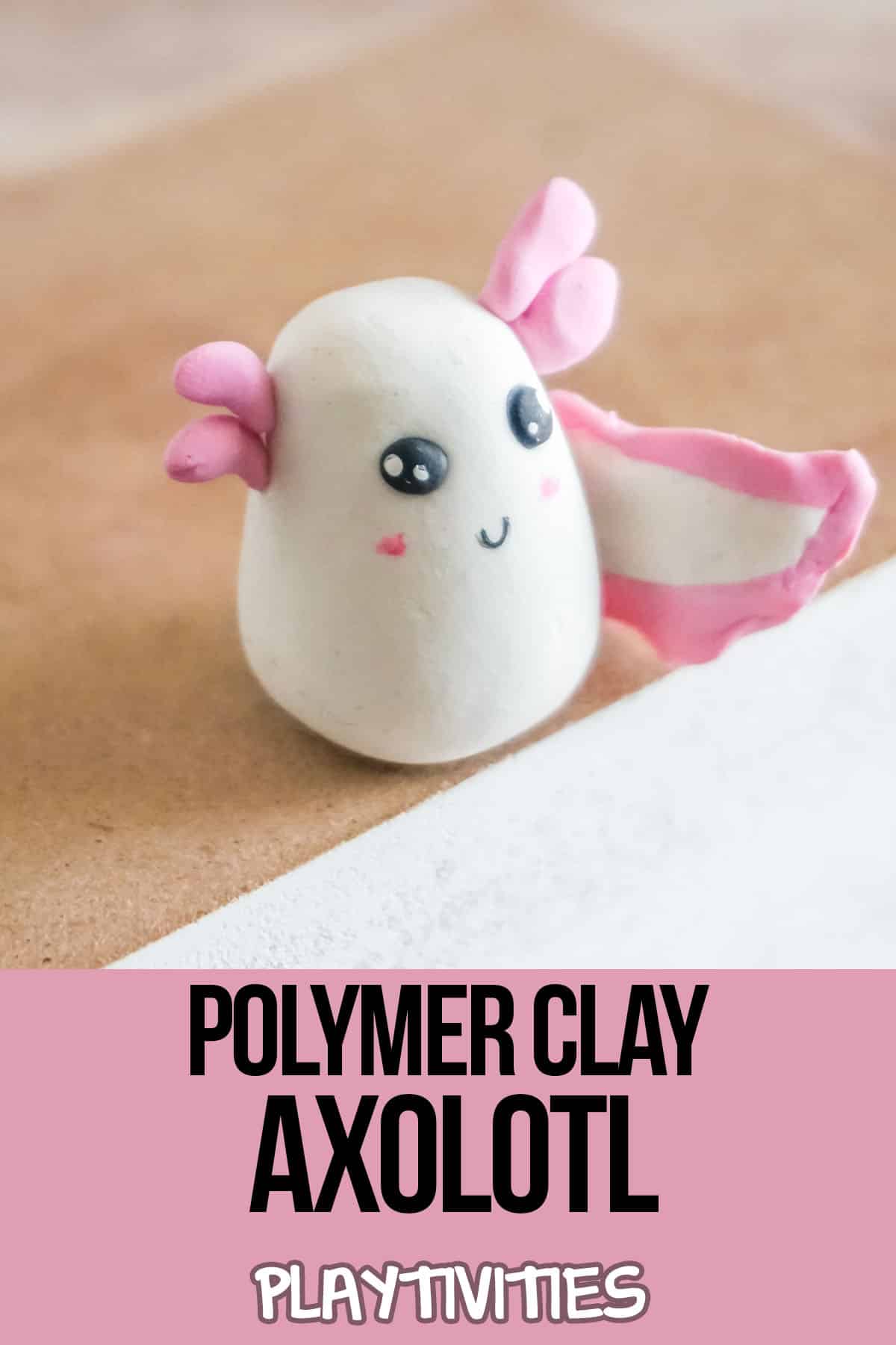 kids craft axolotl from clay with text which reads polymer clay axolotl