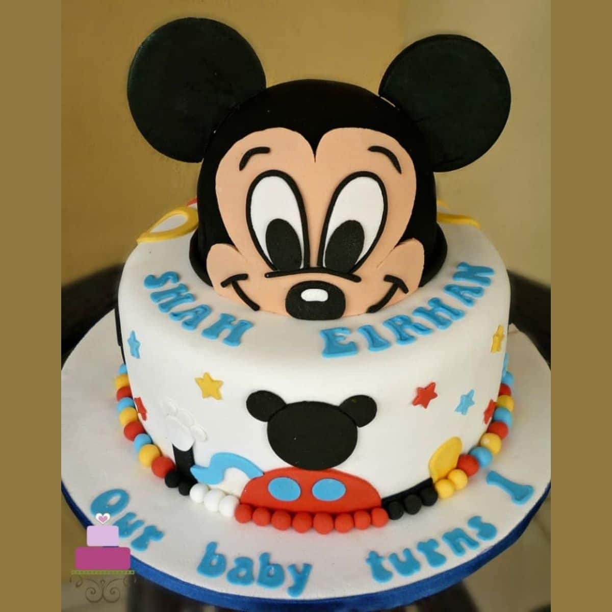 Made this cute [Homemade] Mickey Mouse cake for a special little boy :) -  red velvet cake filled with cream cheese frosting, frosted with white  chocolate buttercream, topped off with [Homemade] macarons